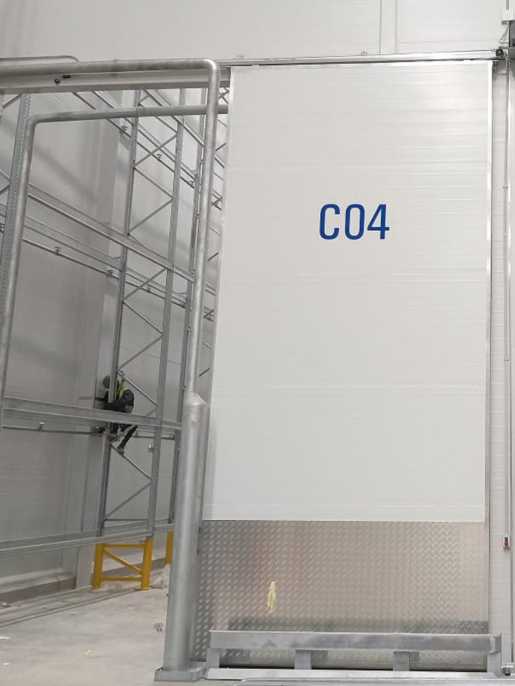 custom operational and directional signage installed inside a freshmark cold storage warehouse