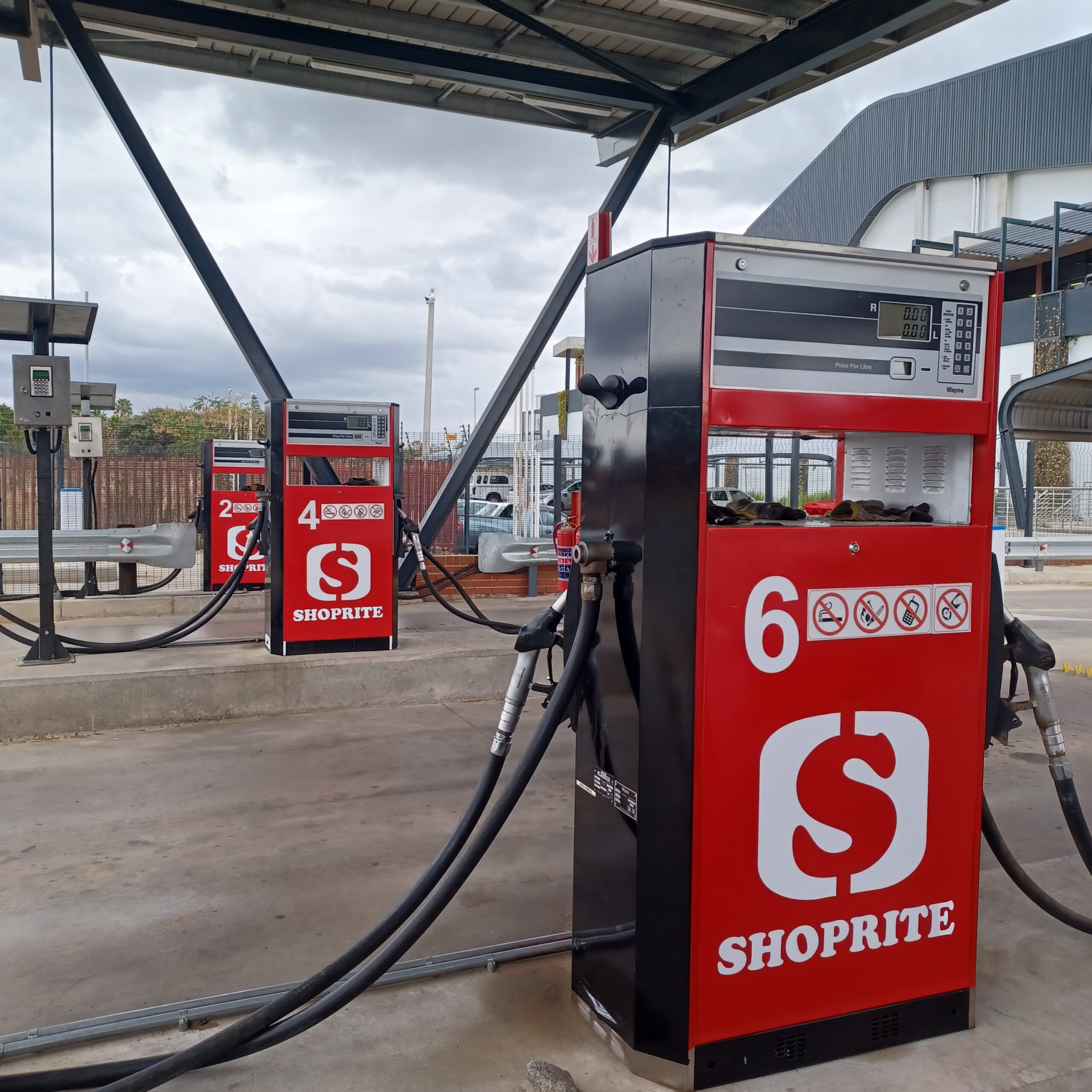 Custom Shoprite fuel pump branding and high-durability outdoor vinyl decals fabricated and installed by Specifusion